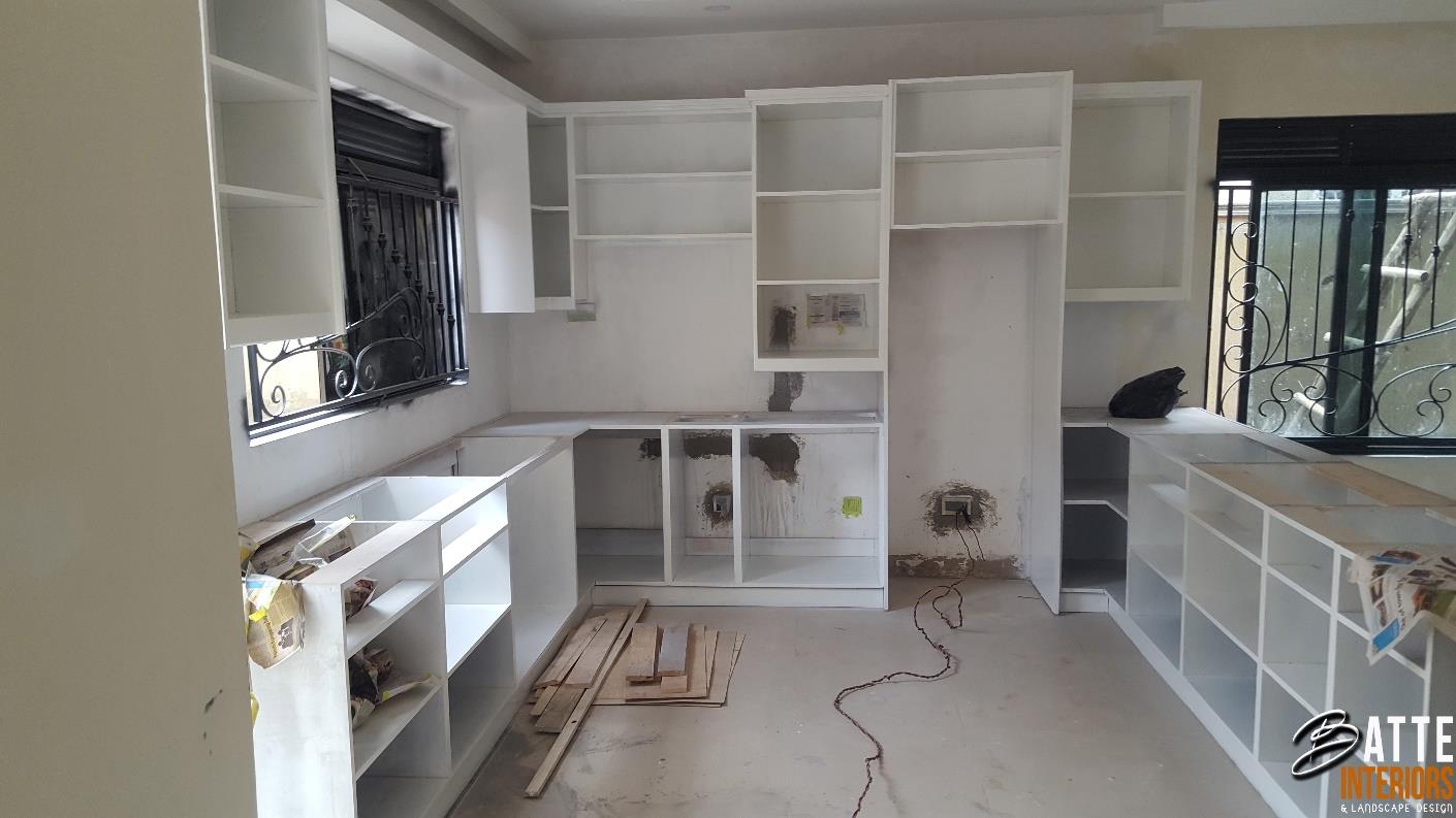 Completed kitchen with two-tone cabinetry and island