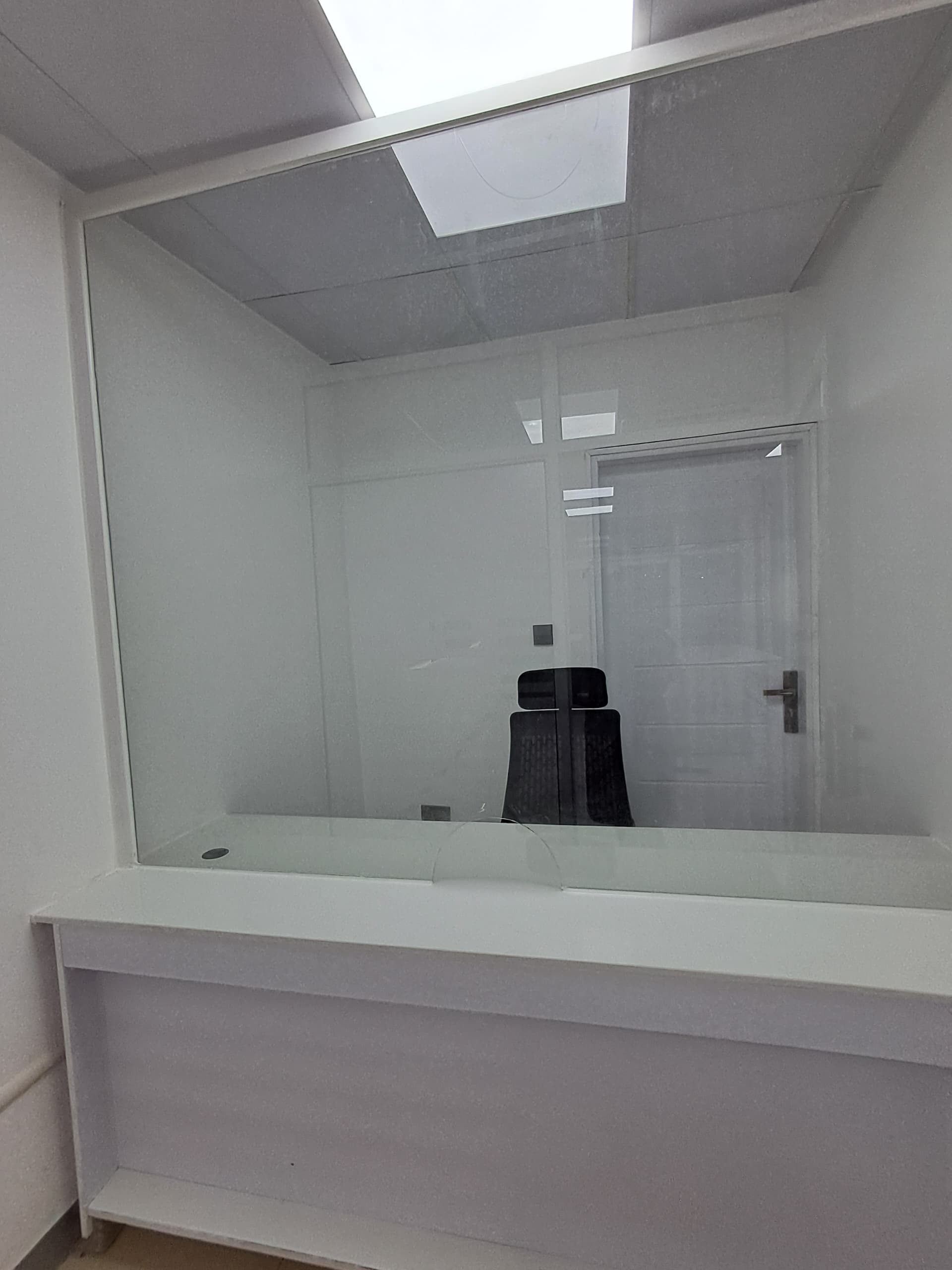 Glass partitioned meeting room in a completed office fit-out