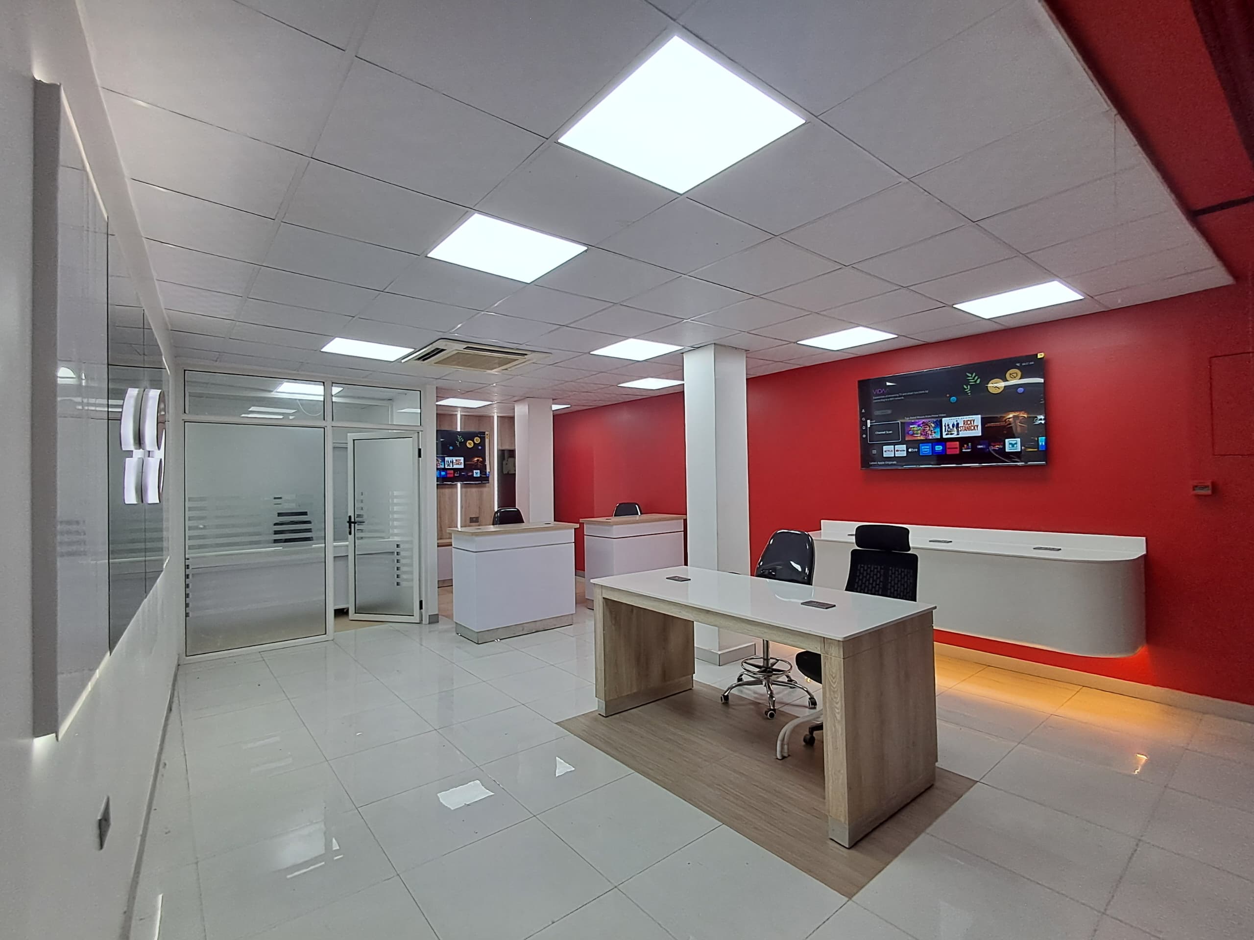 Completed office ceiling with recessed lighting and service integration