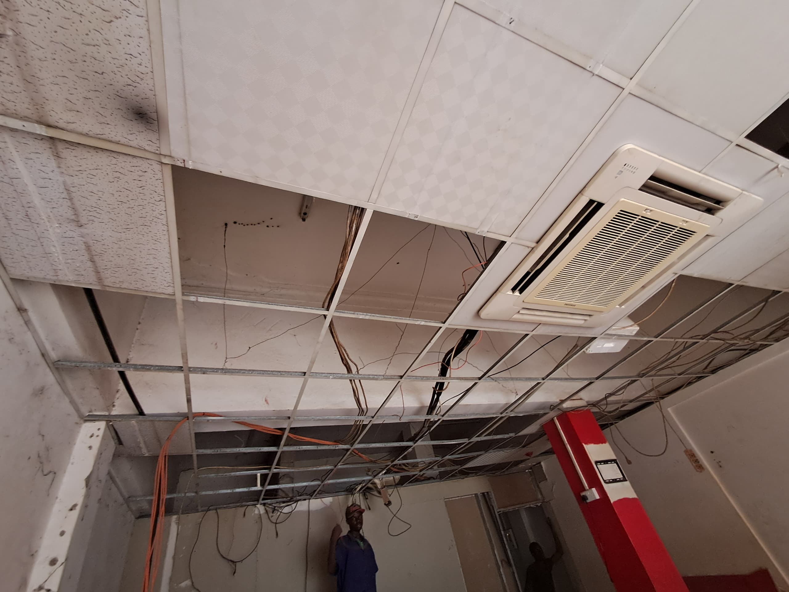 Office strip-out with exposed ceiling grid before the new fit-out
